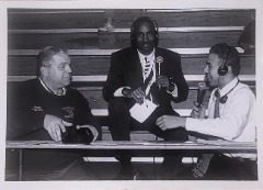 McKinney (right) interviewing with Major Leaguer Lance Johnson (center) during his Triton Jersey Number retirement ceremony in 1997.